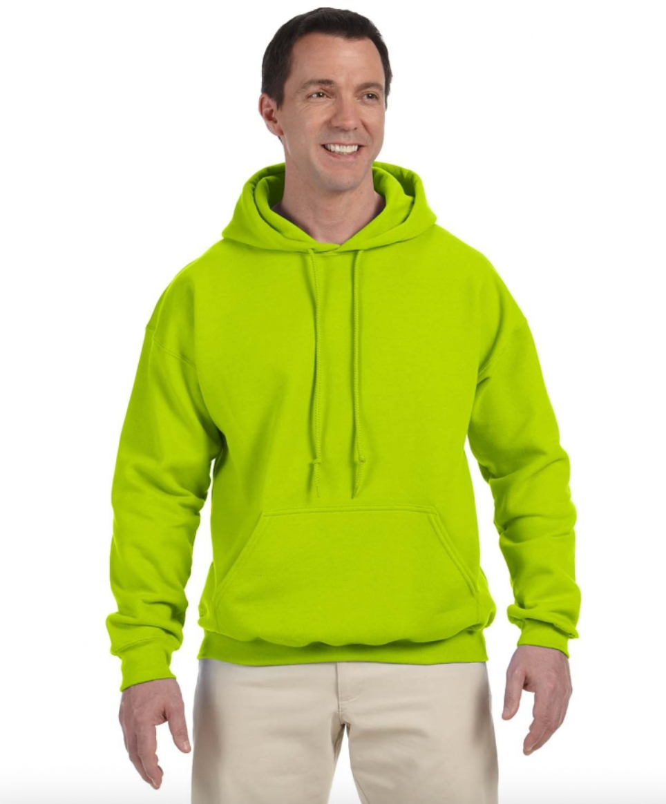 Man wearing a bright green hoodie on a white background