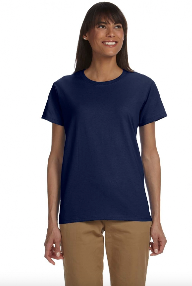 Woman wearing a navy blue t-shirt and beige pants on a white background