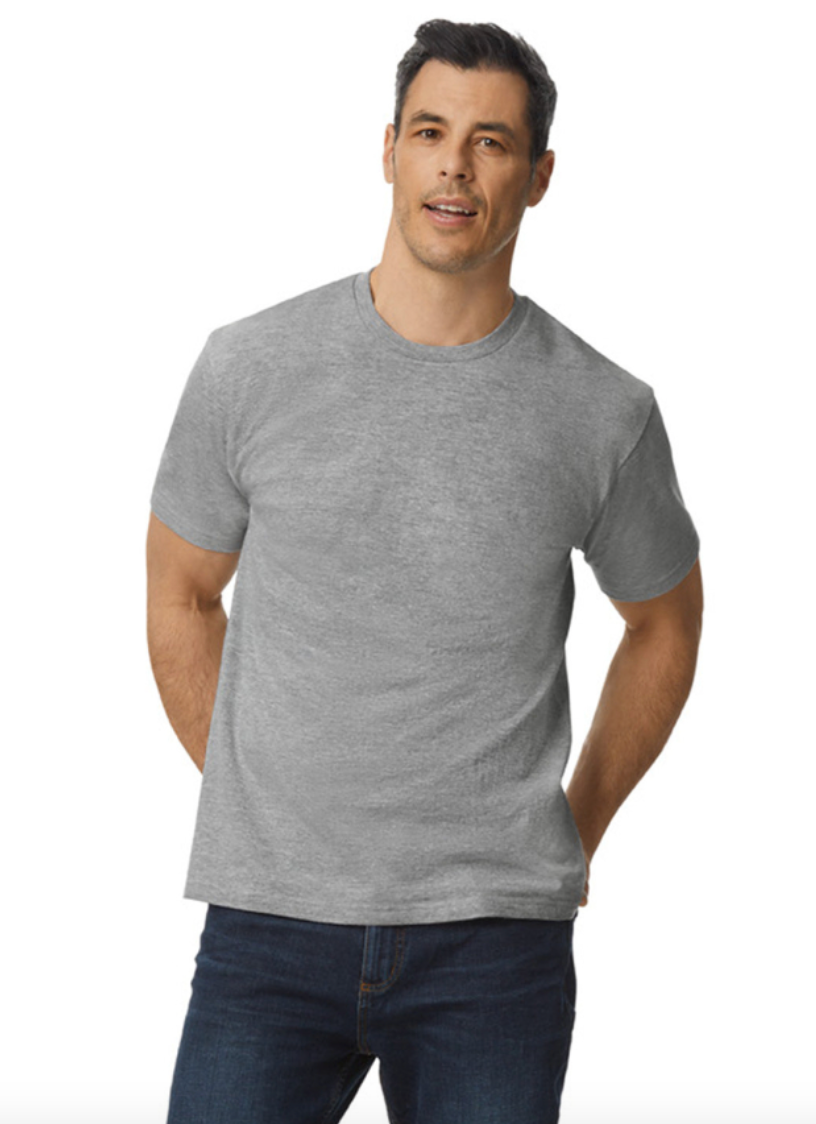 Man wearing a gray t-shirt and dark jeans on a white background