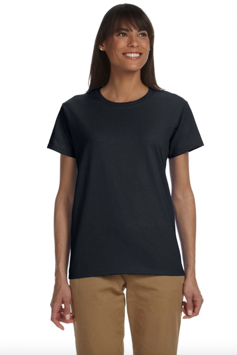 Woman wearing a black t-shirt and beige pants on a white background