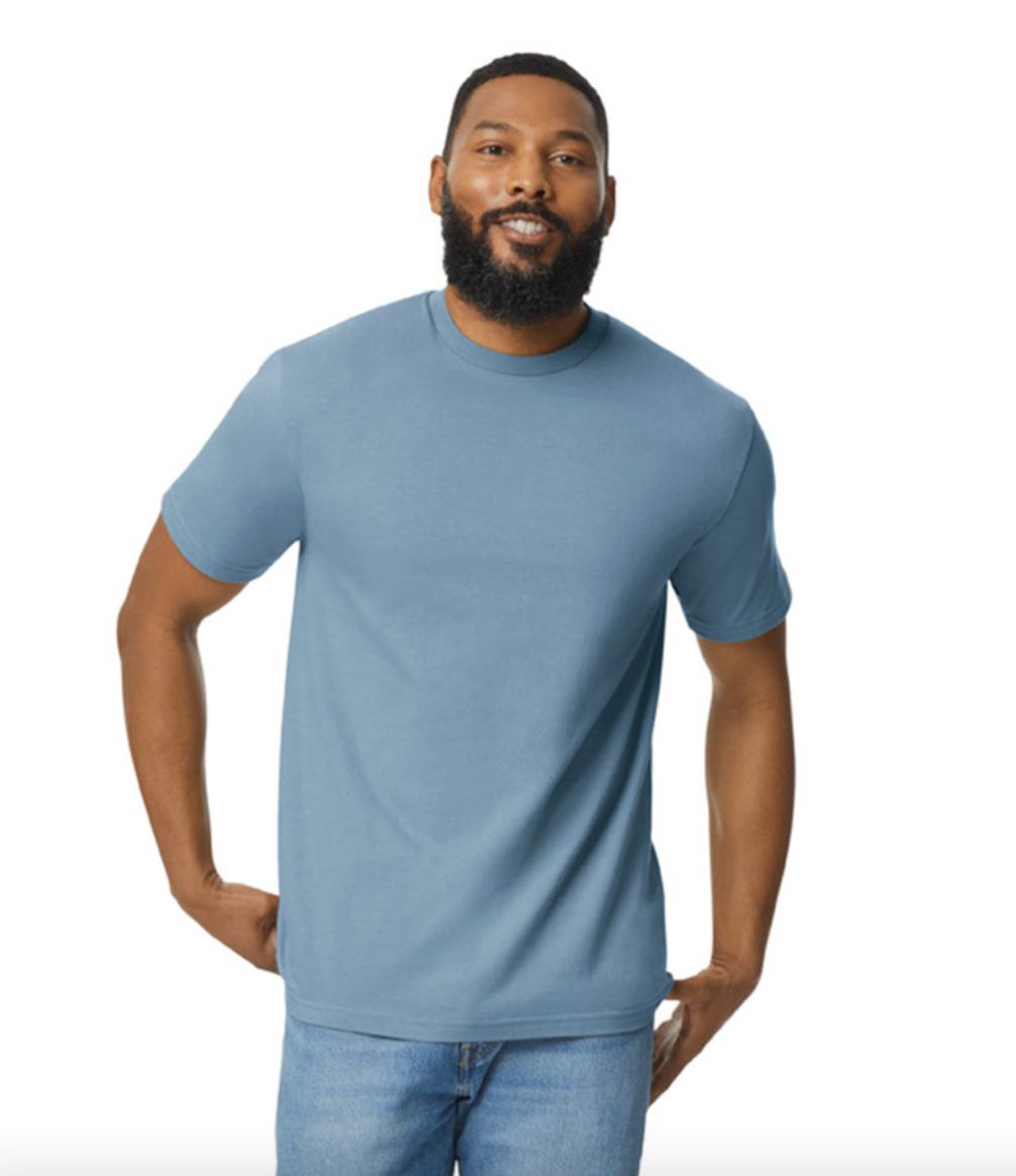 Man wearing a light blue t-shirt and jeans on a white background