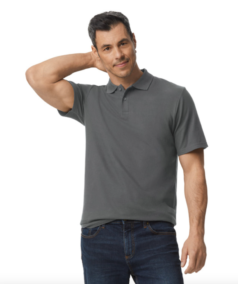 Man wearing a gray polo shirt and blue jeans on a white background