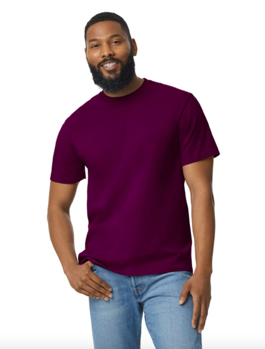 Man wearing a purple t-shirt and blue jeans on a white background