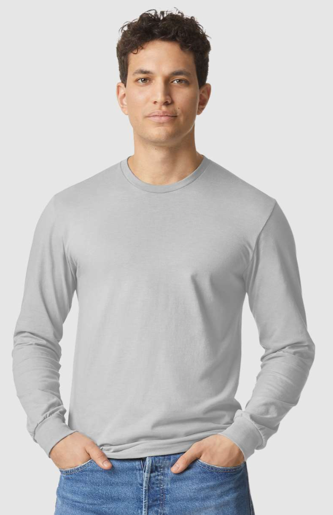 Man wearing a gray long-sleeve shirt and blue jeans on a light gray background