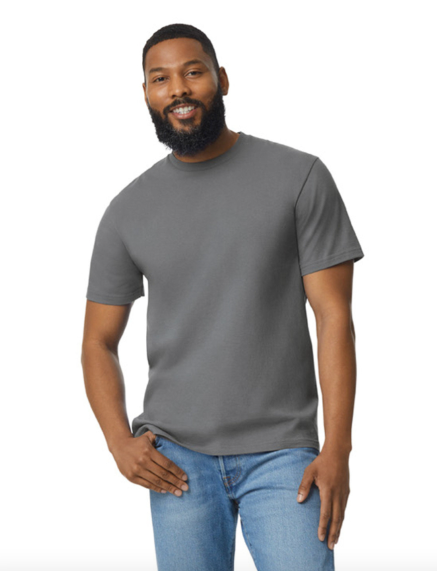 Man wearing a gray t-shirt and blue jeans on a white background
