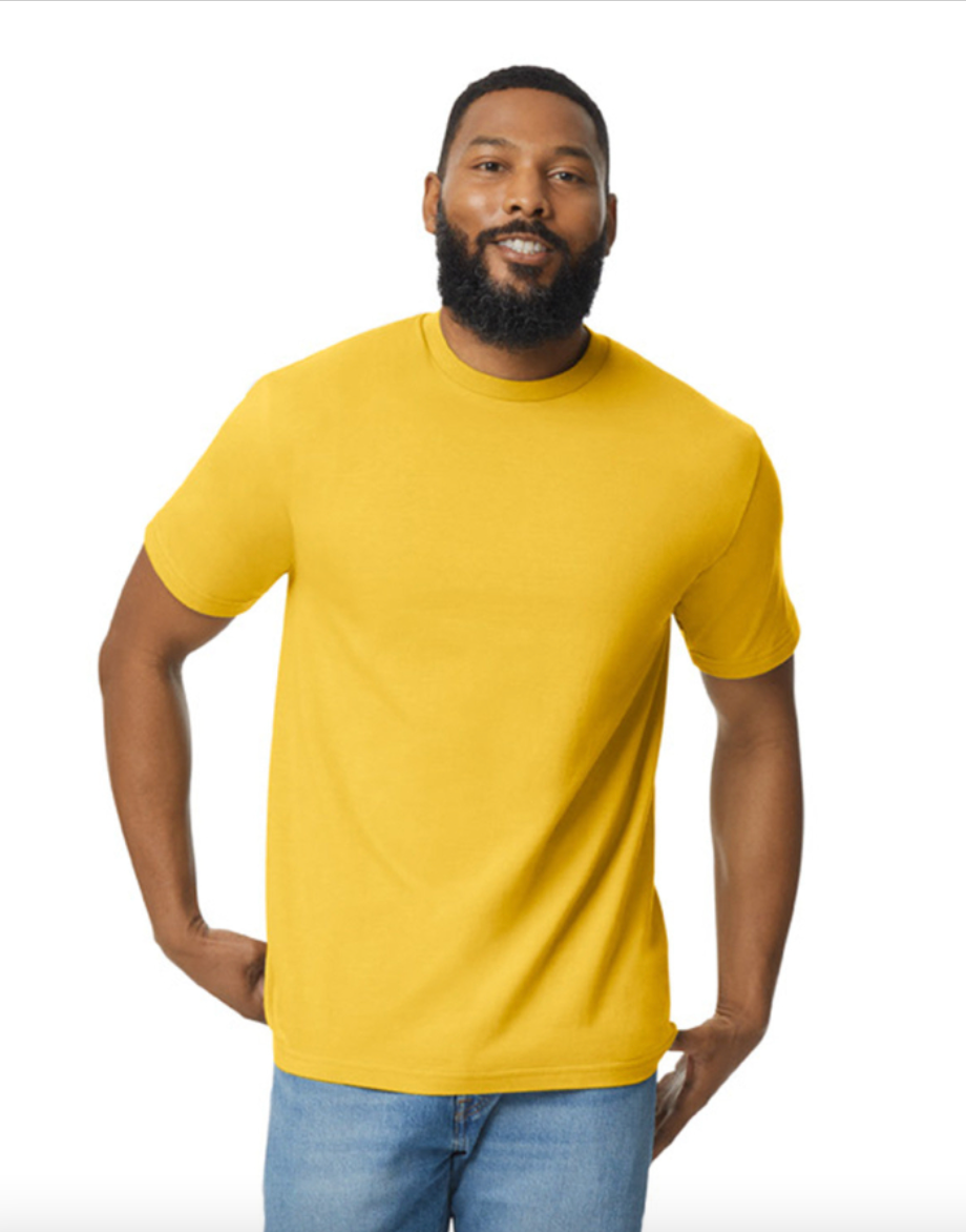 Man wearing a yellow t-shirt and blue jeans on a white background