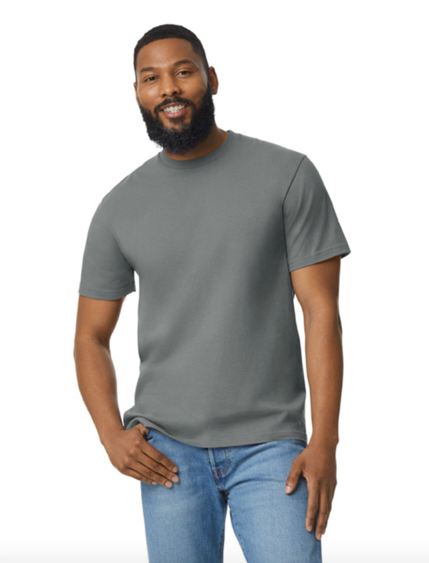 Man wearing a gray t-shirt and blue jeans on a white background