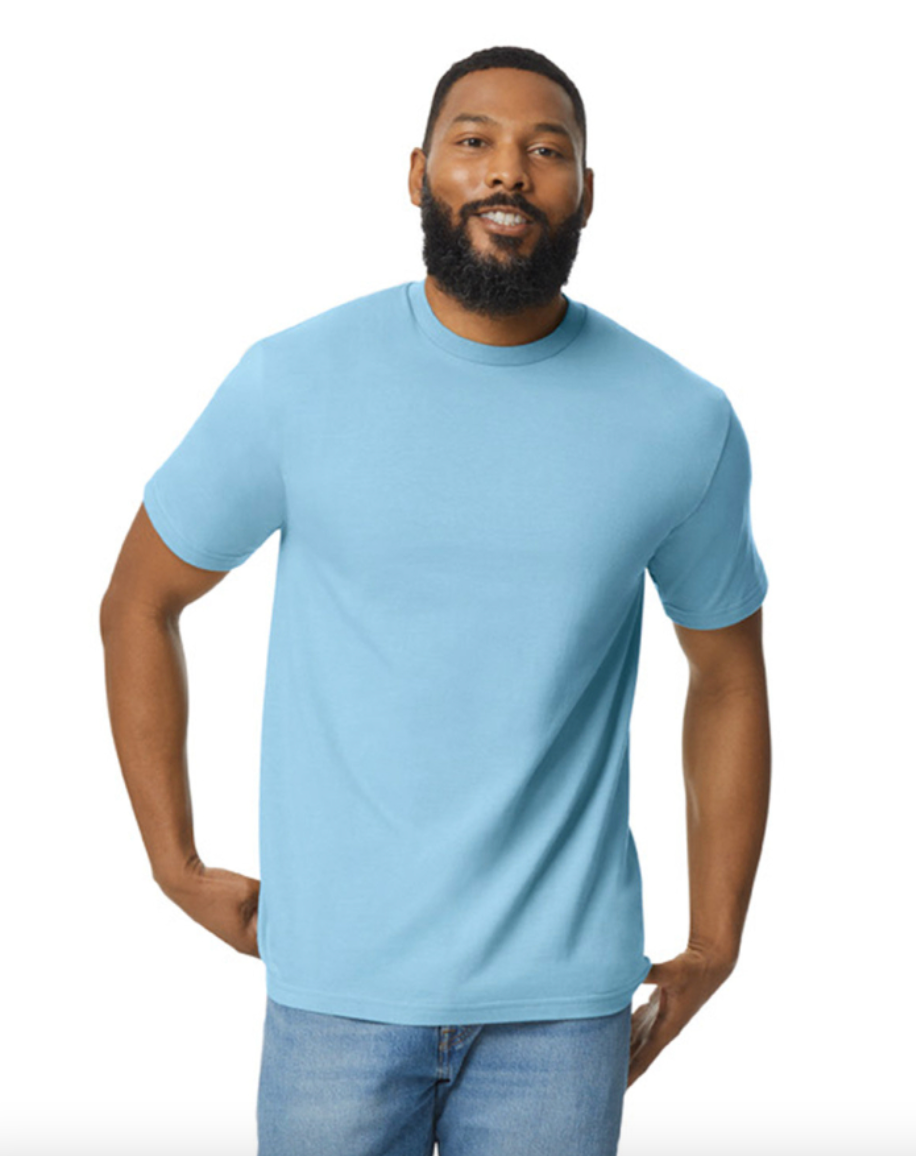 Man wearing a light blue t-shirt and jeans on a white background