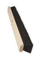 Long rectangular brush with black bristles on a white background