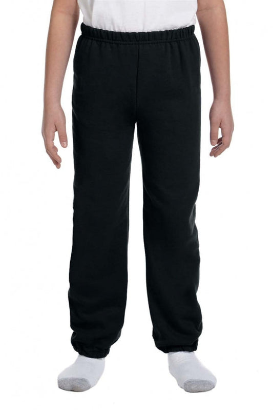 Person wearing black pants on a white background