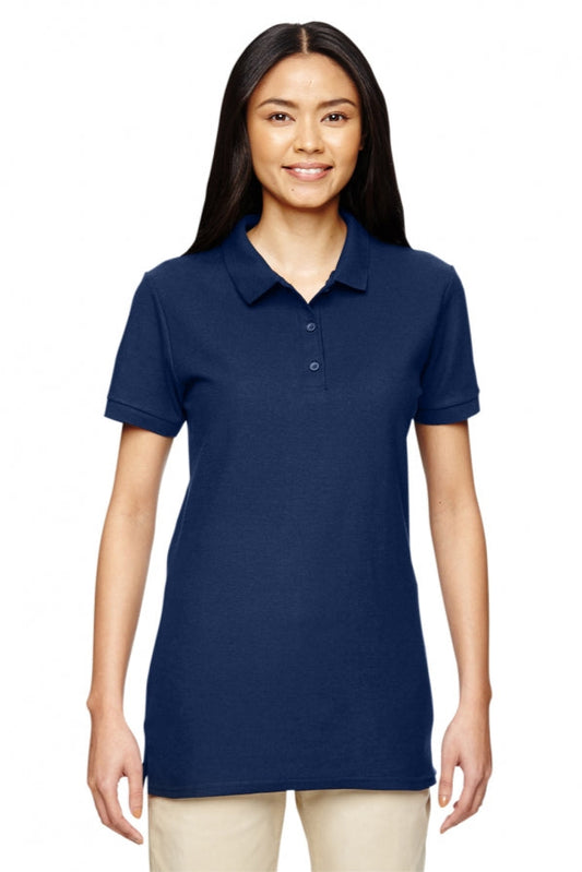 Woman wearing a navy blue polo shirt on a white background