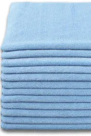 Stack of blue folded towels on a white background
